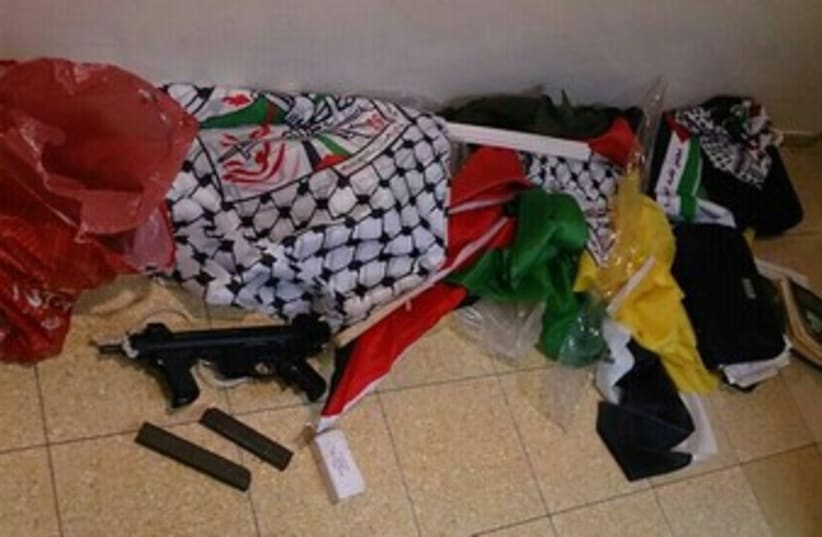 A weapons stash found at the home of an Abu Dis resident. (photo credit: Courtesy of police)