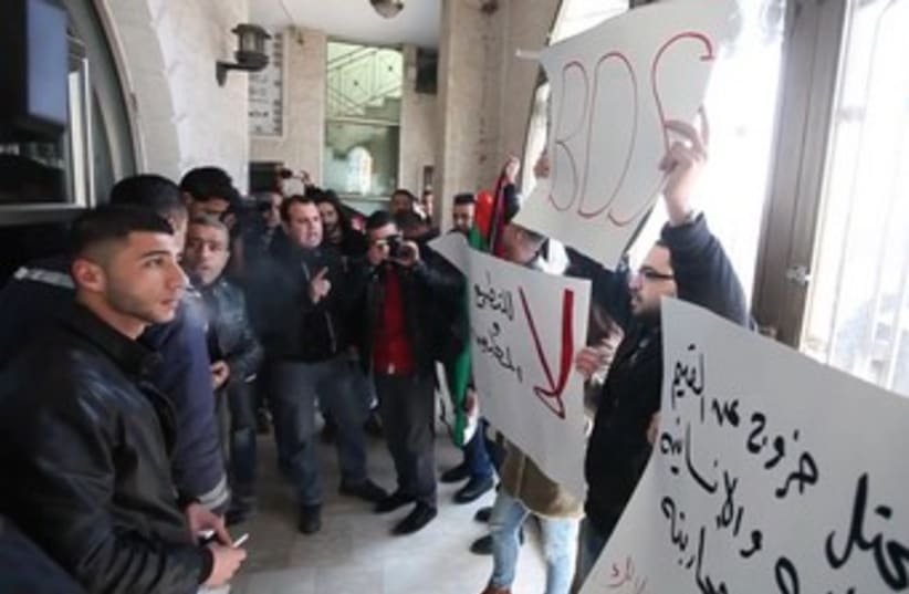 Palestinian activists protest Israeli-Palestinian activists peace meeting in Ramallah, January 9, 2014. (photo credit: YouTube Screenshot)