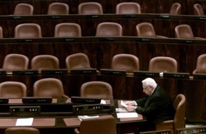 Ariel Sharon alone at the Knesset [file]. (photo credit: REUTERS/Natalie Behring)