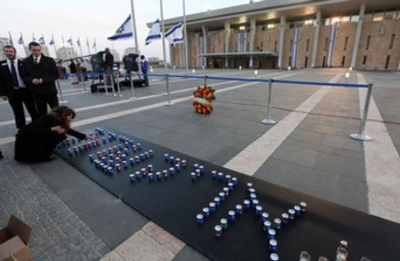 Candles spelling Ariel Sharon's name outside the Knesset, January 12, 2014. (photo credit: Marc Israel Sellem/The Jerusalem Post)