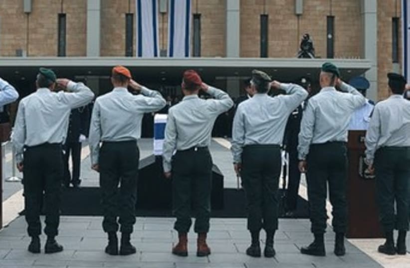IDF generals salute the coffin of former prime minister Ariel Sharon at the Knesset  (photo credit: Marc Israel Sellem/The Jerusalem Post))