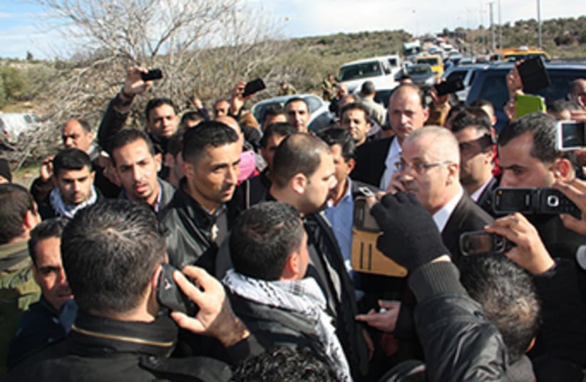 Palestinian Authority Prime Minister Rami Hamdallah after being pulled over by Israel Police in the West Bank on Tuesday.  (photo credit: Farah Studio Ramallah)