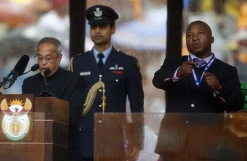 Sign language interpreter at Nelson Mandela's funeral. (photo credit: Reuters)