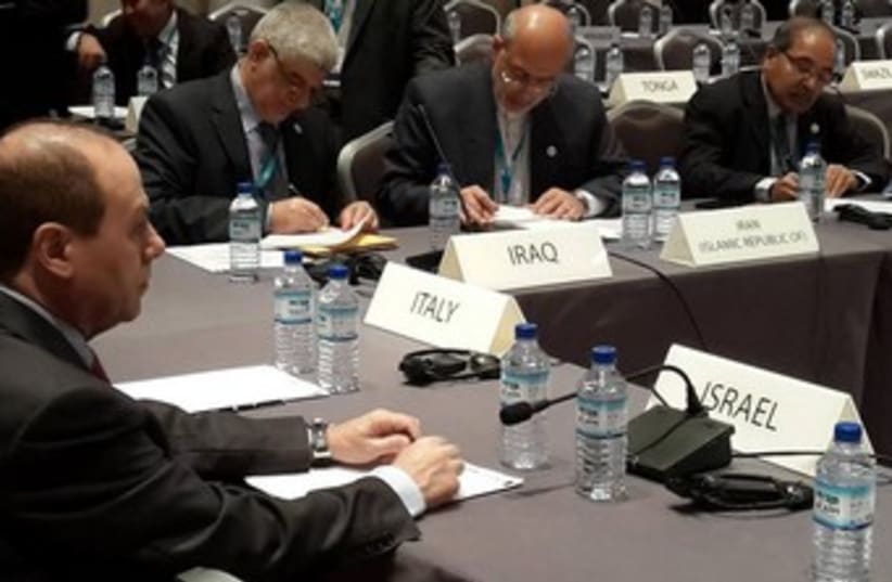 Energy Minister Silvan Shalom at the IRENA assembly with Iranian Energy Minister Hamid Chitchiyan  in Abu Dhabi. (photo credit: Courtesy)