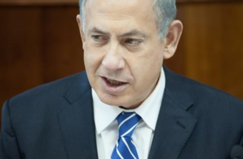 Prime Minister Binyamin Netanyahu at the weekly cabinet meeting, January 19, 2014. (photo credit: EMIL SALMAN/POOL)