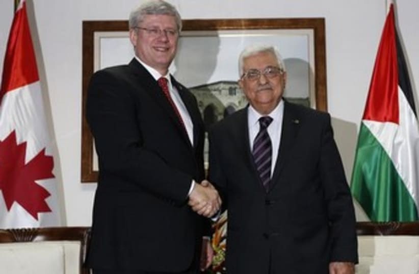 Canadian Prime Minister Stephen Harper and Palestinian Authority President Mahmoud Abbas in Ramallah on Monday. (photo credit: REUTERS)
