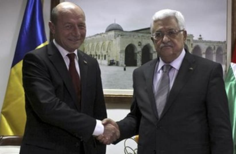 Palestinian Authority President Mahmoud Abbas meeting with Romania's President Traian Basescu in Ramallah, January 21, 2014. (photo credit: REUTERS)