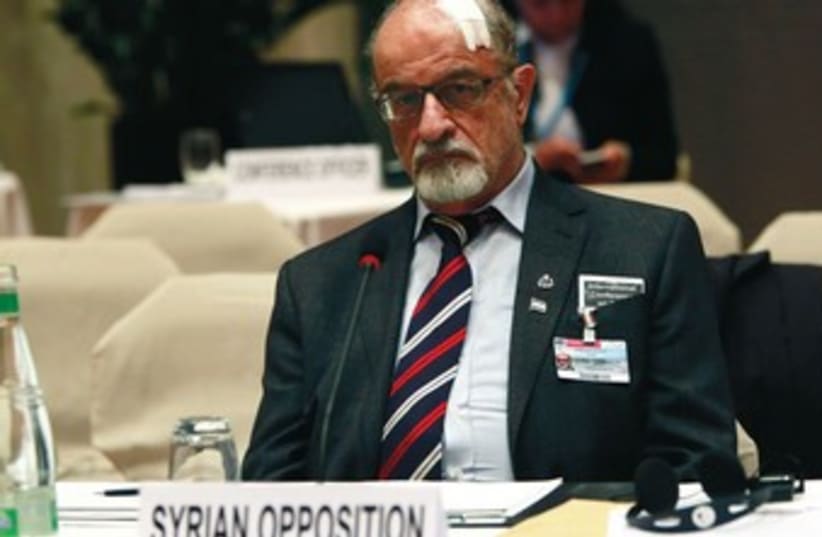 THE SYRIAN national coalation agreed to attend Geneva 2 only after Western threats and pressure. (photo credit: REUTERS)