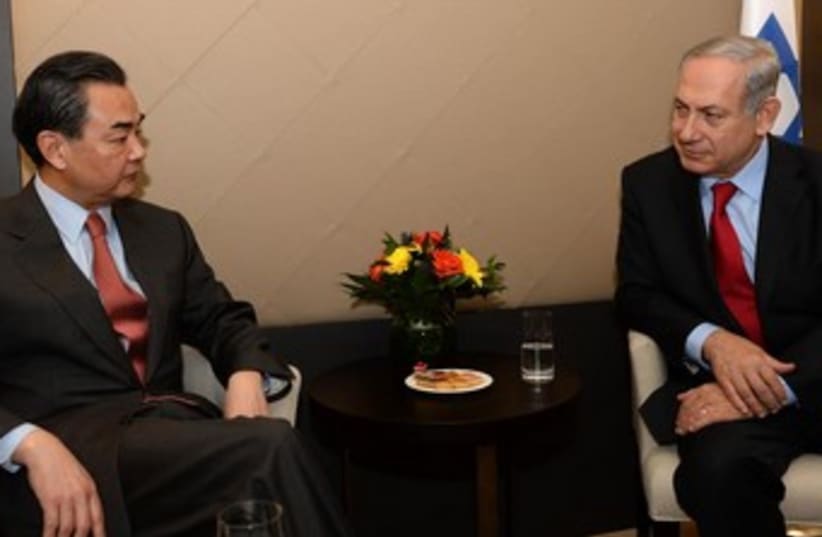 Netanyahu meets with Chinese FM Wang Yi in Davos  (photo credit: GPO)