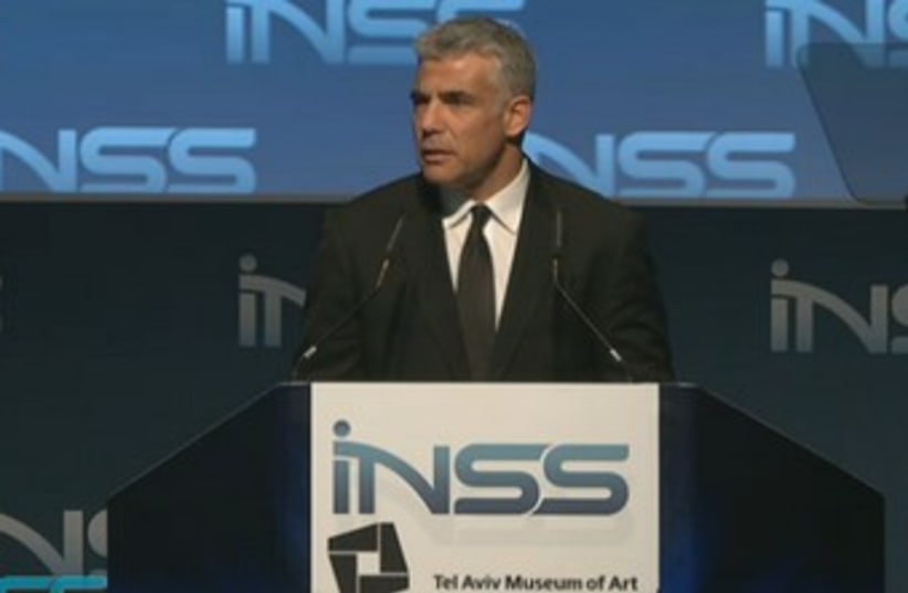 Finance Minister Yair Lapid addresses the INSS conference in Tel Aviv, January 29, 2014. (photo credit: INSS)