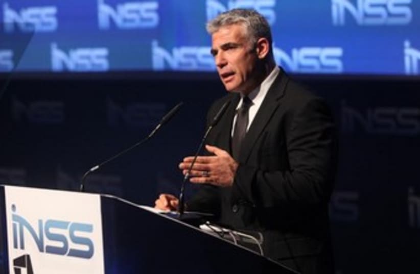 Finance Minister Yair Lapid addresses the INSS conference in Tel Aviv, January 29, 2014. (photo credit: CHEN GALILI)