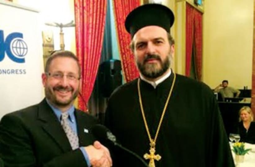 Fr. Gabriel Naddaf with MK Dov Lipman. (photo credit: SAM SOKOL)