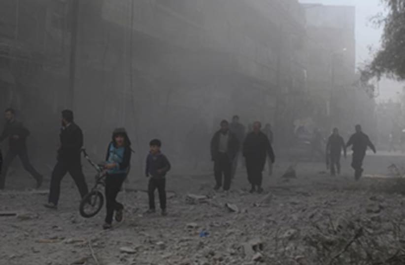 Human rights group report says Assad regime razing entire neighborhoods‏ (photo credit: REUTERS)