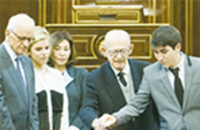 Isaac Revah a Bergen Belsen survivor lit a candle in the Spanish Senate in Madrid (photo credit: CENTRO SEFARD-ISRAEL)