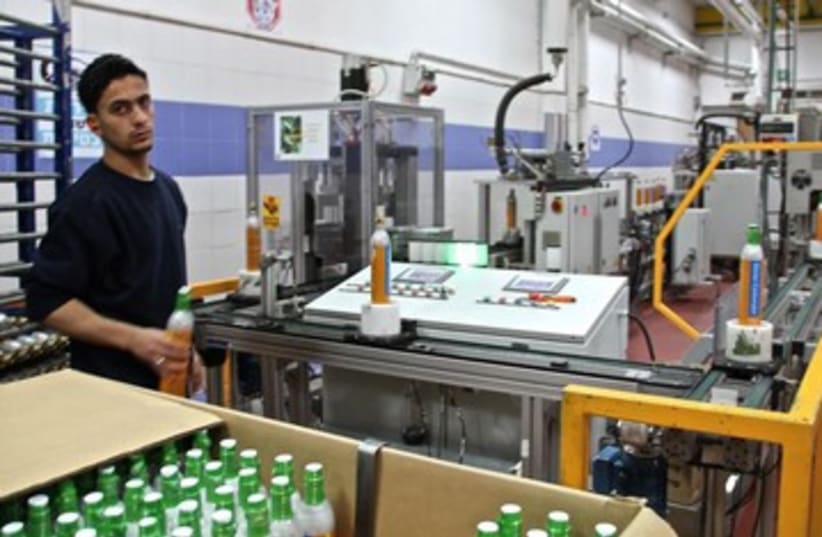 Employees at the SodaStream factory at the ishor Adumim Industrial Park in the West Bank. (photo credit: TOVAH LAZAROFF)