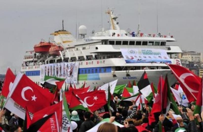 Pro-Palestinian activists wave Turkish and Palestinian flags during the welcoming ceremony for cruise liner Mavi Marmara at the Sarayburnu port of Istanbul December 26, 2010. (photo credit: REUTERS)