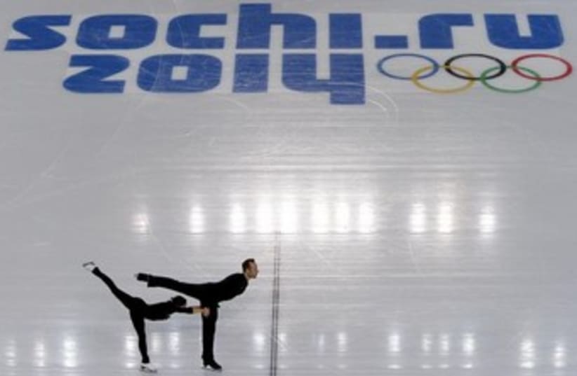 A couple skates at a pairs figure skating training session at the Iceberg Skating Palace, in preparation for the 2014 Sochi Winter Olympics February 4, 2014. (photo credit: REUTERS)