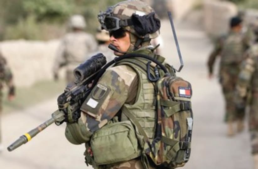 A FRENCH soldier of the NATO-led coalition patrols in the mountains of Wardak Province in Afghanistan in 2009. (photo credit: REUTERS)