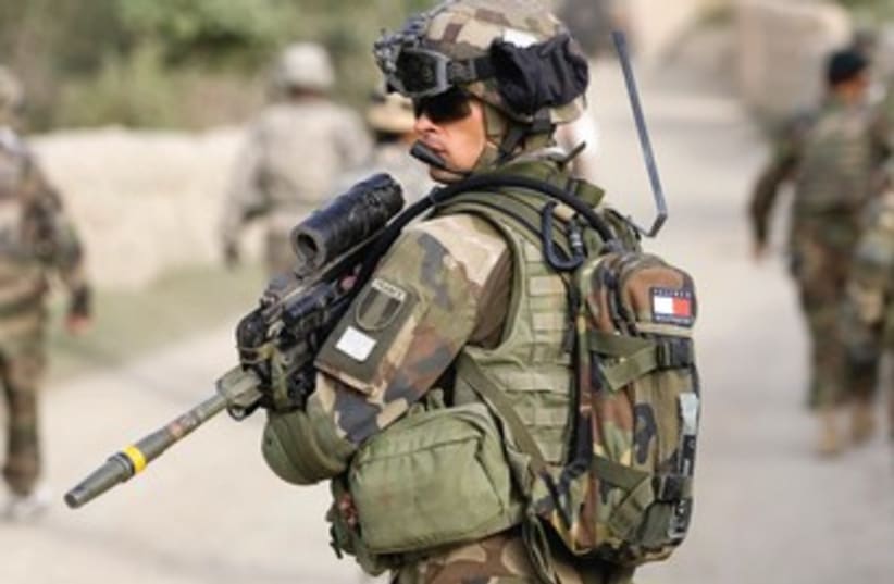 A FRENCH soldier of the NATO-led coalition patrols in the mountains of Wardak Province in Afghanistan in 2009. (photo credit: REUTERS)