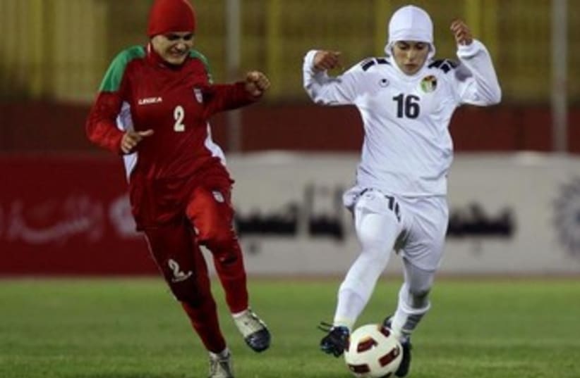 A soccer player from Iran's women's team at a qualifying match for the 2012 London Olympics. (photo credit: REUTERS)