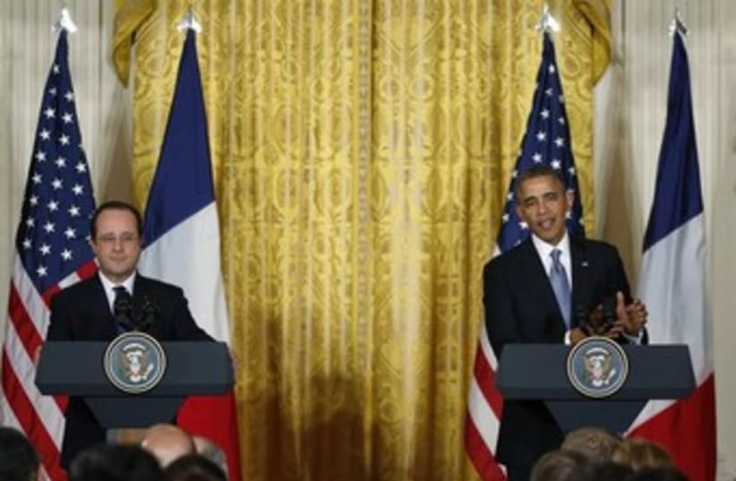 US President Barack Obama and French President Francois Hollande address a joint news conference in Washington, February 11, 2014. (photo credit: REUTERS)