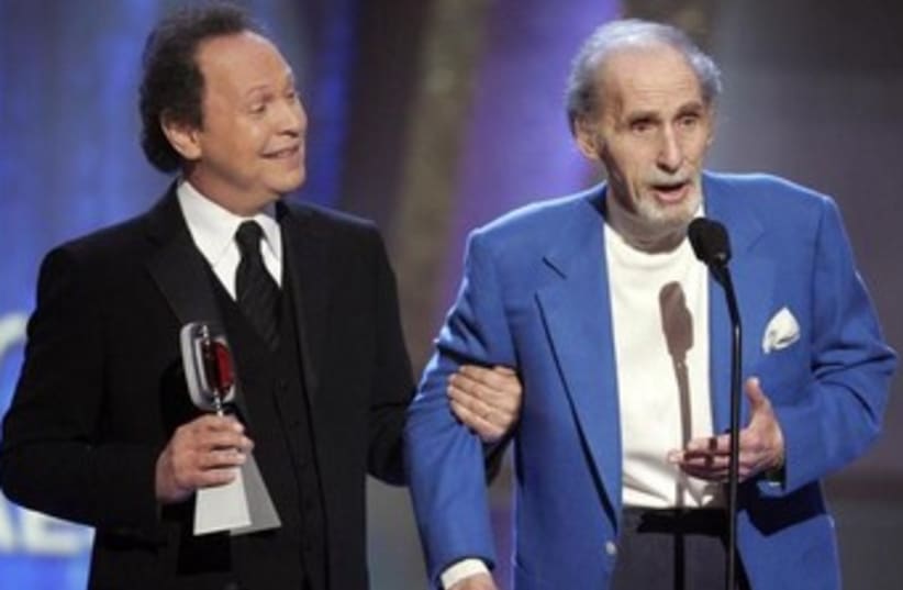 Comedians Sid Caesar (R) and Billy Crystal (photo credit: REUTERS)