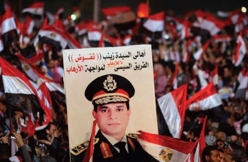 Supporters of Abdel Fatah al-Sisi in Tahrir square in Cairo, on the third anniversary of Egypt’s uprising, January 25 (photo credit: REUTERS)