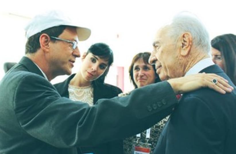 Peres listens to Yosef Abramowitz as wife Susan and her sister comedian Sarah Silverman look on. (photo credit: Courtesy)