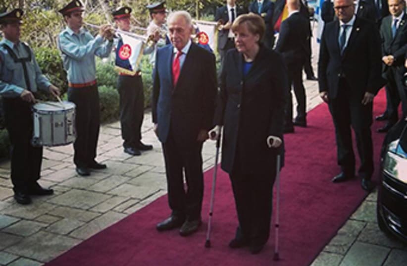 President Peres and German Chancellor Merkel‏ (photo credit: GPO)