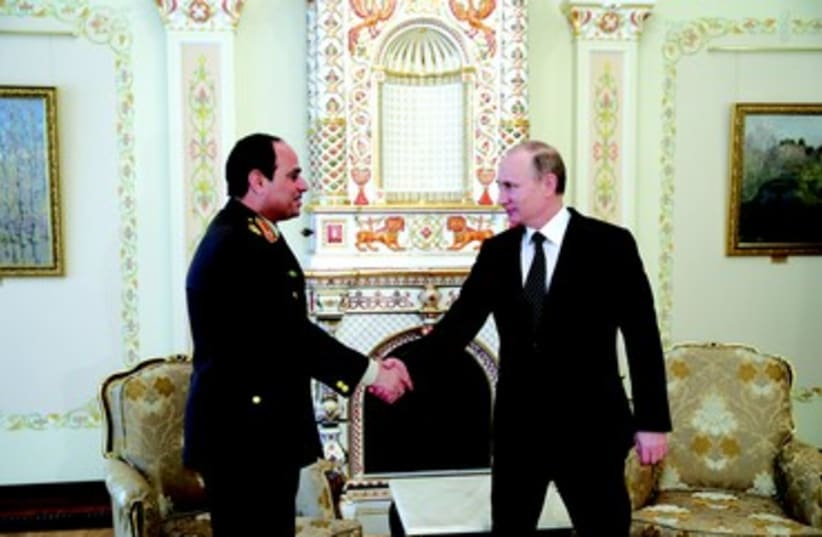 Vladimir Poutine et le maréchal Al Sissi (photo credit: REUTERS)