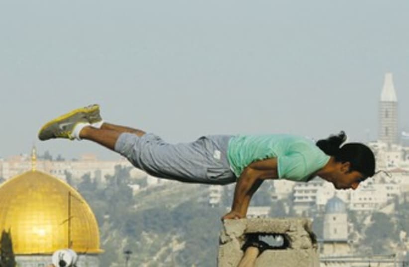 Palestinian youth practices parkour (photo credit: REUTERS)