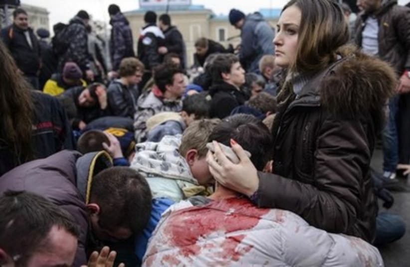 Wounded supporters of pro-government forces in Ukraine recover from riots. (photo credit: REUTERS)