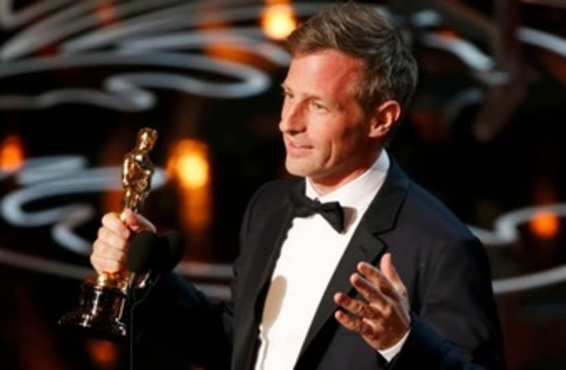 Spike Jonze, winner original screenplay for "Her", speaks on stage at the 86th Academy Awards in Hollywood, California March 2, 2014. (photo credit: REUTERS)