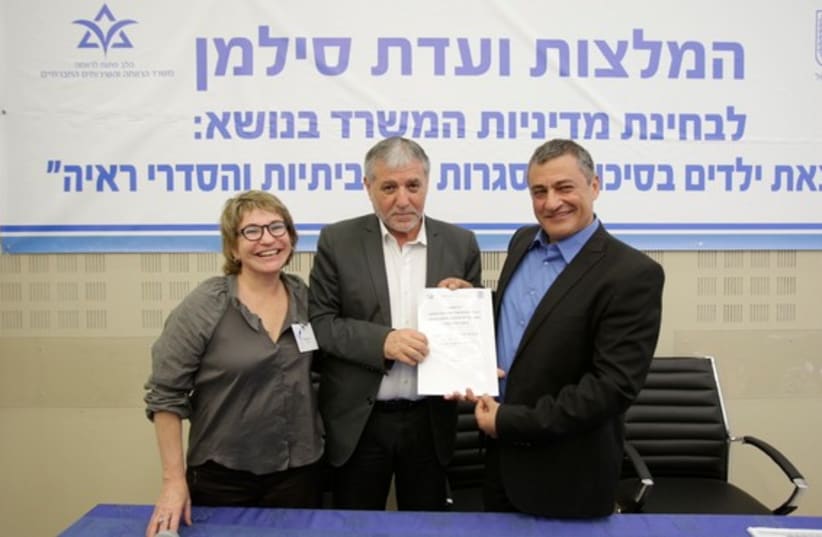 Yossi Silman, director-general of the Welfare Ministry (right), Welfare Minister Meir Cohen, and Head of the Association of Social Workers, Safra Dweck (left) at the Welfare Ministry press conference in Tel Aviv (photo credit: WELFARE MINISTRY SPOKESWOMAN)