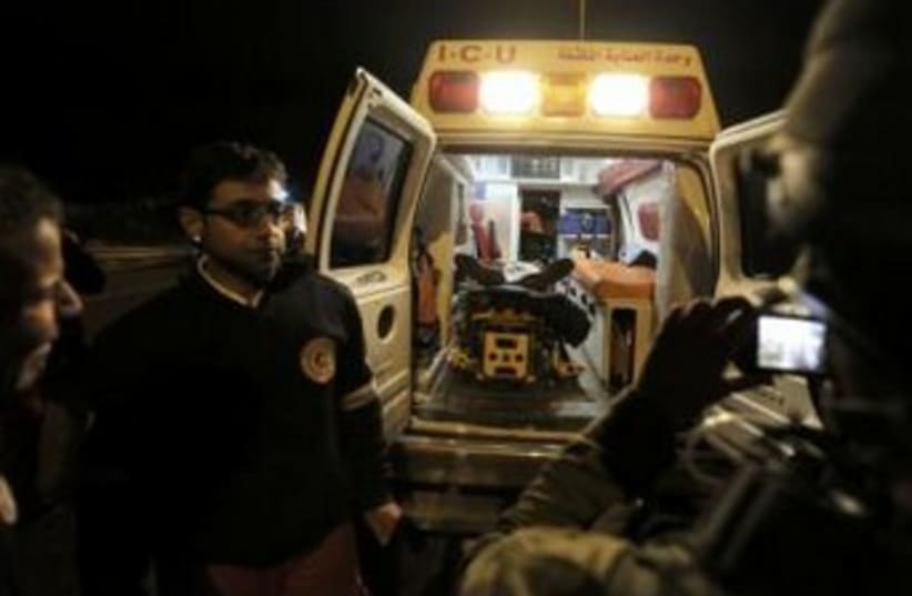 Ambulance in West Bank after Palestinian killed (photo credit: REUTERS)