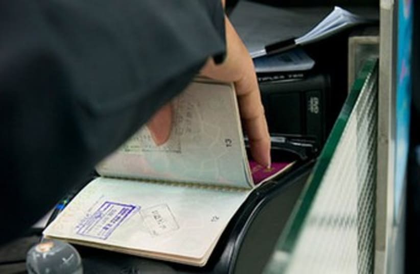Passport check (photo credit: INTERPOL WEBSITE)