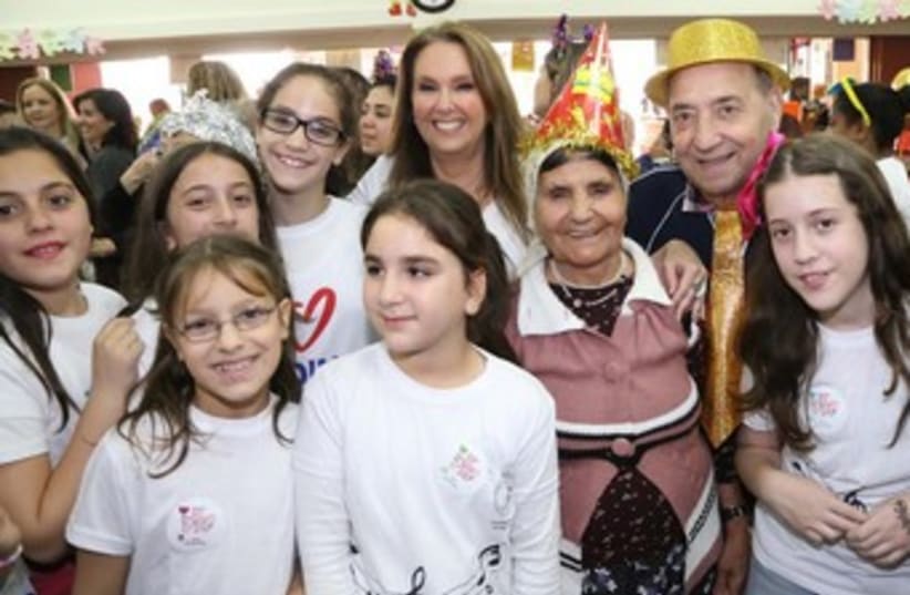 Shari Arison, initiator of Good Deeds Day at a Purim party for the elderly organized by school children. (photo credit: SIVAN FARAG)
