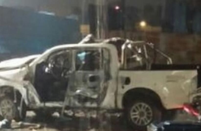 Exploded car in Netanya, March 13, 2014. (photo credit: BEN HARTMAN)