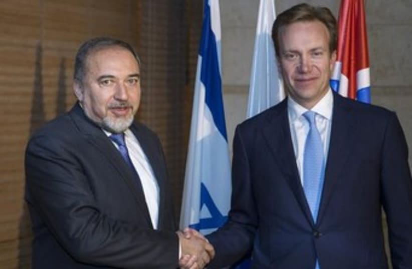 Foreign Minister Avigdor Liberman (L) greets Norway's foreign minister, Borge Brende, in November. (photo credit: REUTERS)