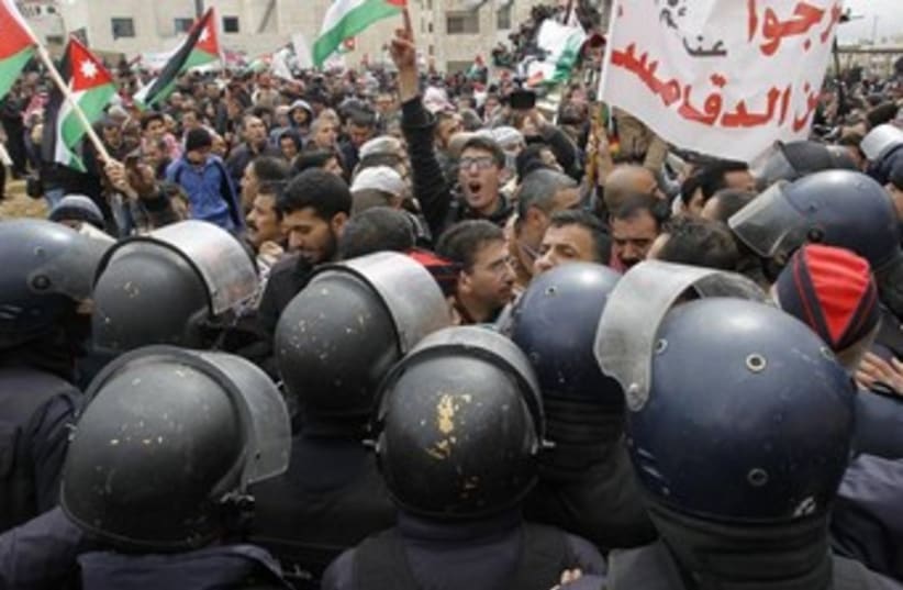 Jordanians protest outside the Israeli embassy in the capital of Amman. (photo credit: REUTERS)