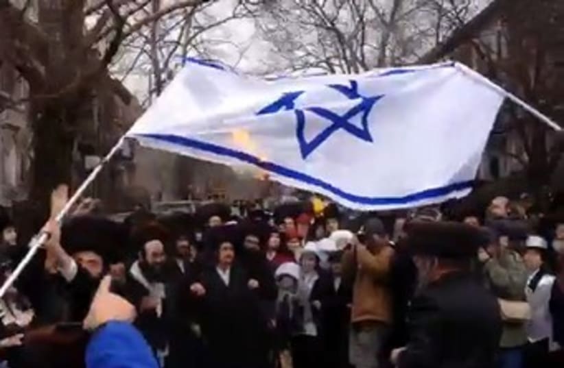 Satmar Hasidim in New York torch Israeli flag during Purim. (photo credit: screenshot)