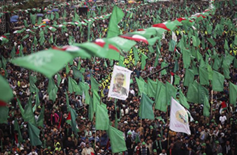 Hamas supporters attend a massive rally in Gaza‏ (photo credit: REUTERS)