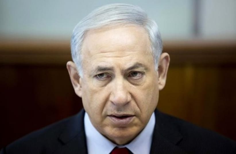 Benjamin Netanyahu attends the weekly cabinet meeting at his office in Jerusalem March 23, 2014.  (photo credit: REUTERS)