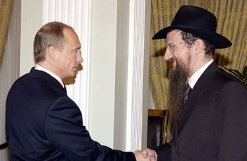 Russian President Vladimir Putin, left, meeting with the Chief Rabbi of Russia Berel Lazar, March 2005 (photo credit: KREMLIN/ JTA)