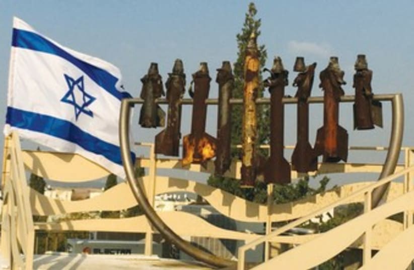 A Hanukkia atop the Sderot Yeshiva is made of rockets that were shot from the Gaza Strip. (photo credit: JORDANA LEBOWITZ)