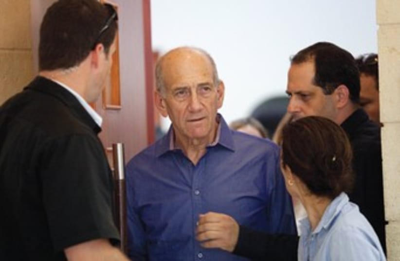 Former prime minister Ehud Olmert leaves the court room after a hearing during a previous corrupution trial. (photo credit: REUTERS)