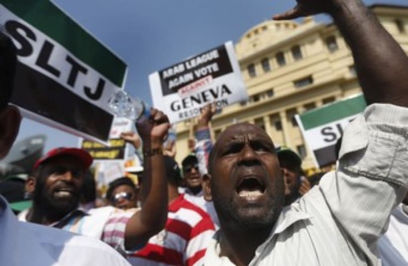 Group of Sri Lankan Muslims shouting slogans, protesting against the UN and U.S.  (photo credit: REUTERS/DINUKA LIYANAWATTE)