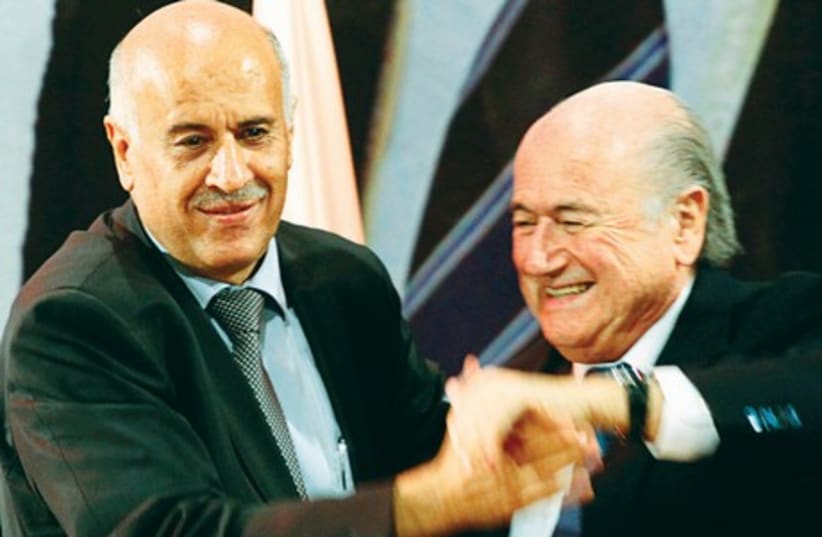 Palestinian FA chairman Jibril Rajoub (L) and FIFA boss Sepp Blatter (photo credit: REUTERS)
