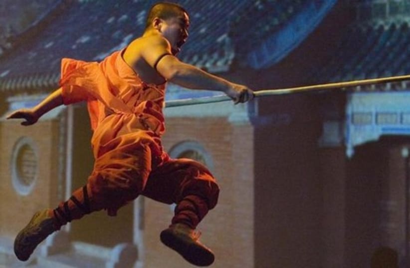 A Shaolin monk does kung fu [Illustrative] (photo credit: REUTERS)