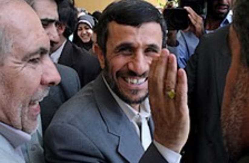 ahmadinejad smiles 224.8 (photo credit: AP)